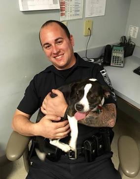 Sergeant Stephen Soares with a found dog